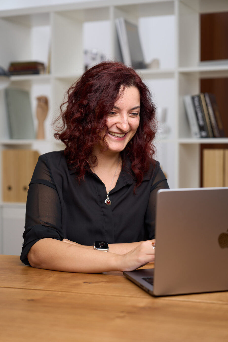 Magda working at her laptop
